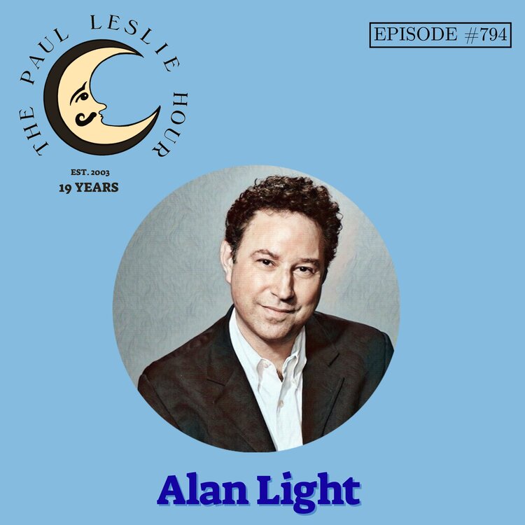 Music journalist Alan Light on light blue background.