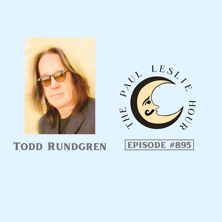 Guitarist Todd Rundgren is shown on a light blue background.