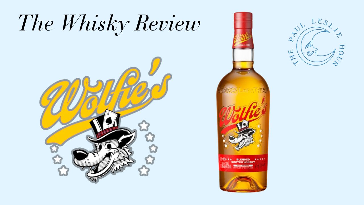 Wolfie's Scotch Whisky bottle is shown on a light blue background with Wolfie's logo.